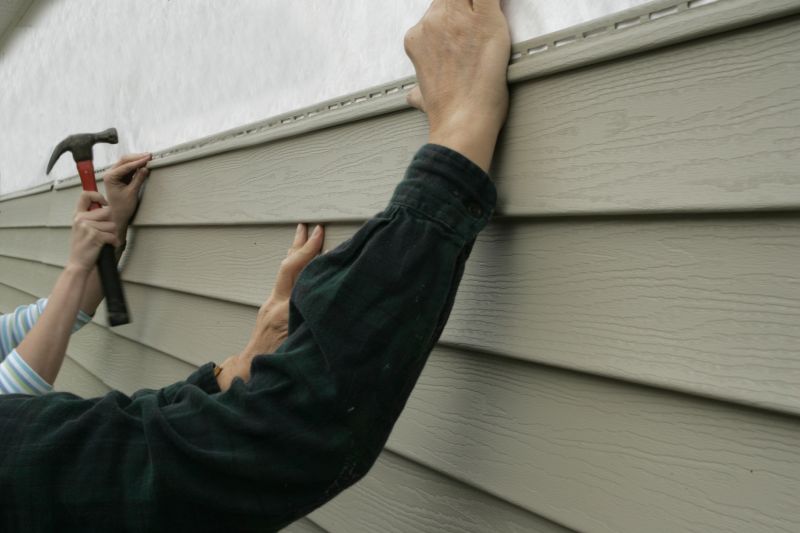 Installing new siding panels